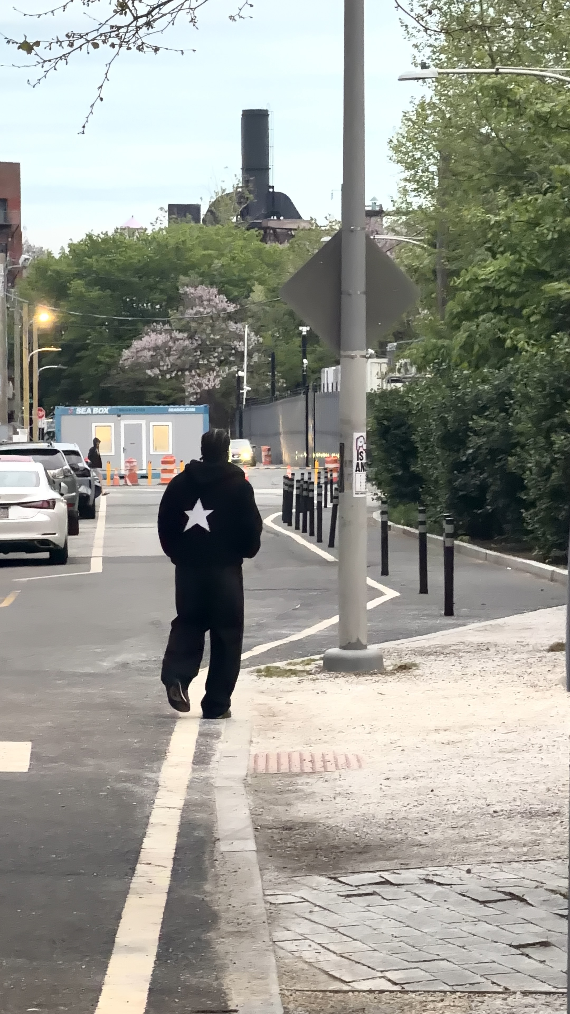 Star Knit - walking away down street, star visible