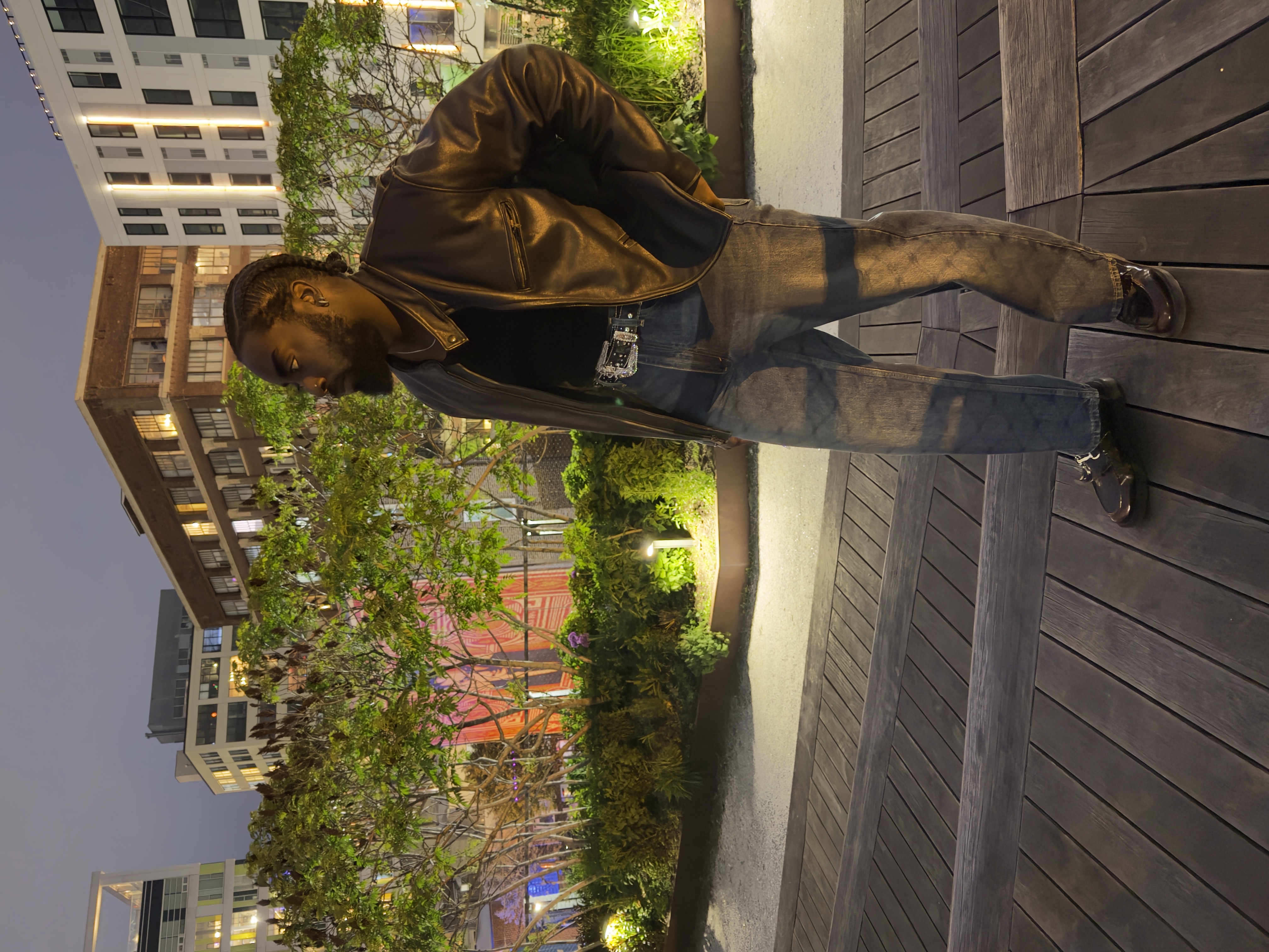 Leather jacket - rooftop terrace, city skyline, side profile
