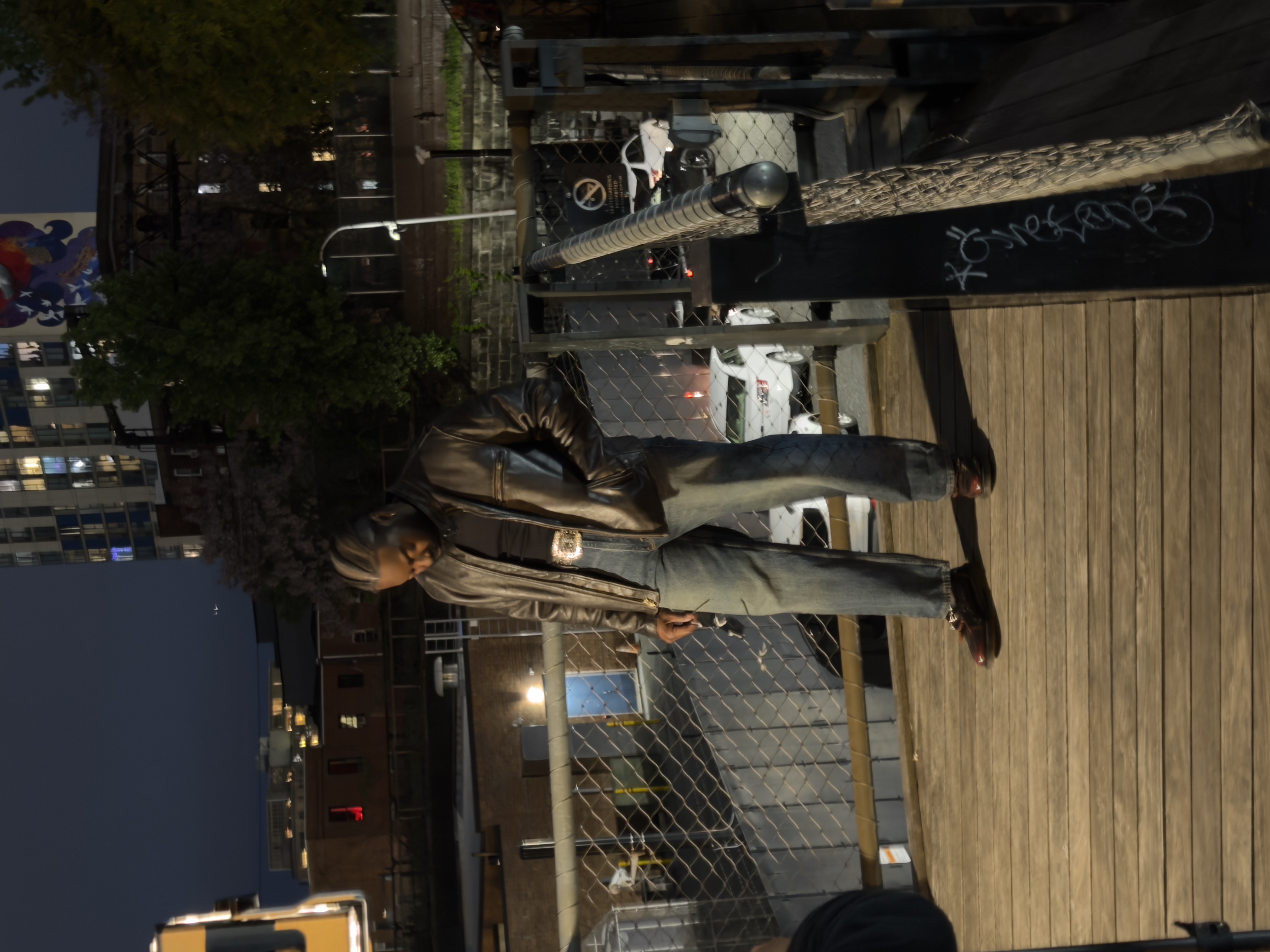 Leather jacket - elevated walkway, dark night, looking down