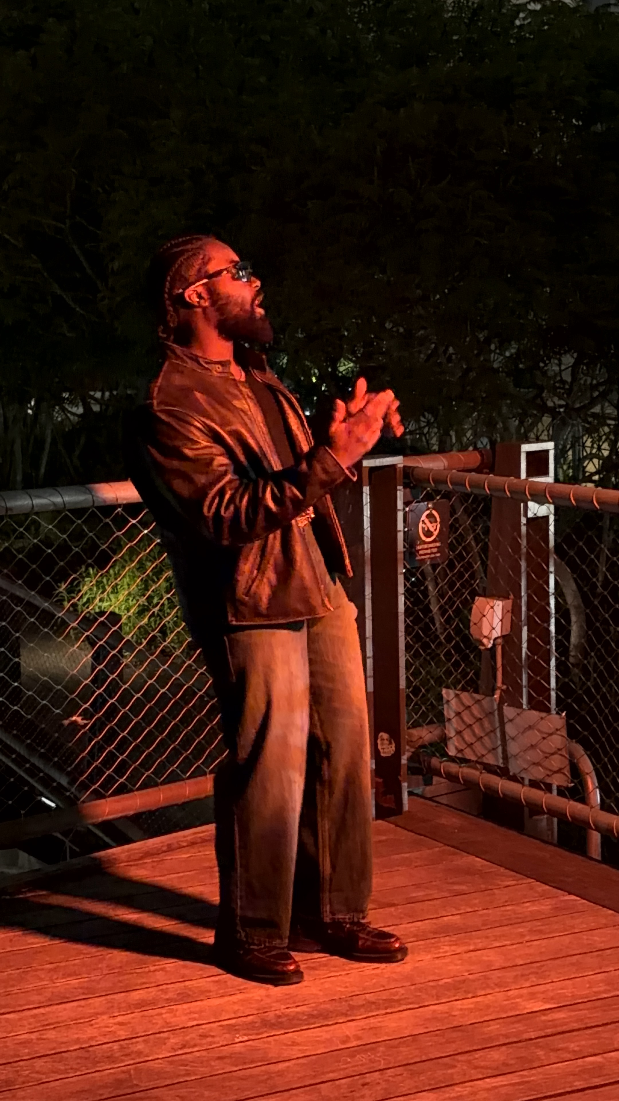 Leather jacket - singing, red light, rooftop